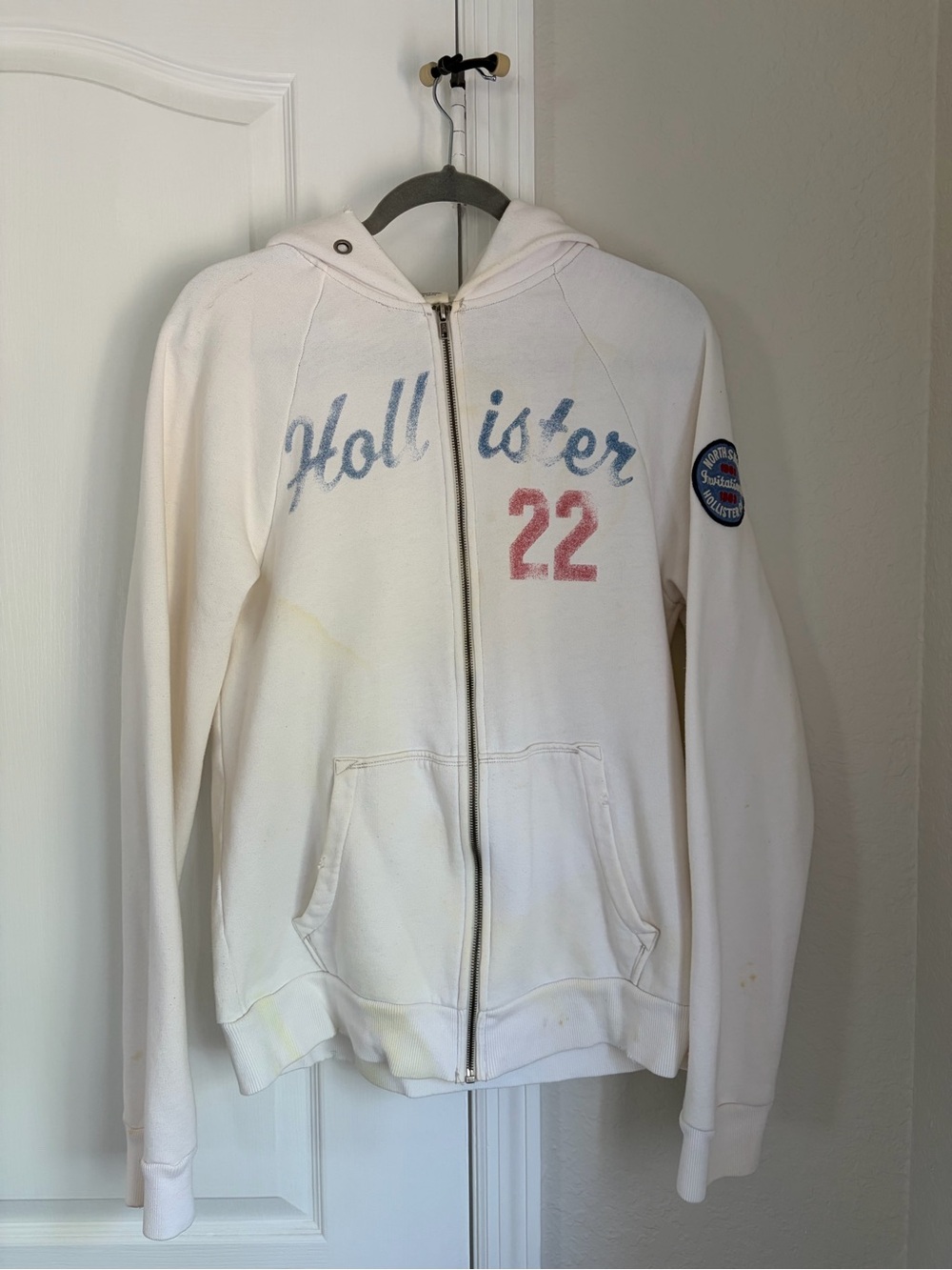 Hollister White Zip Hoodie with Blue Script and Red '22'